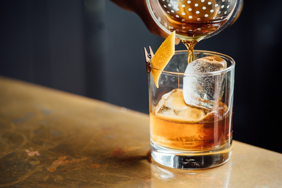 Bartender pouring a cocktail over ice